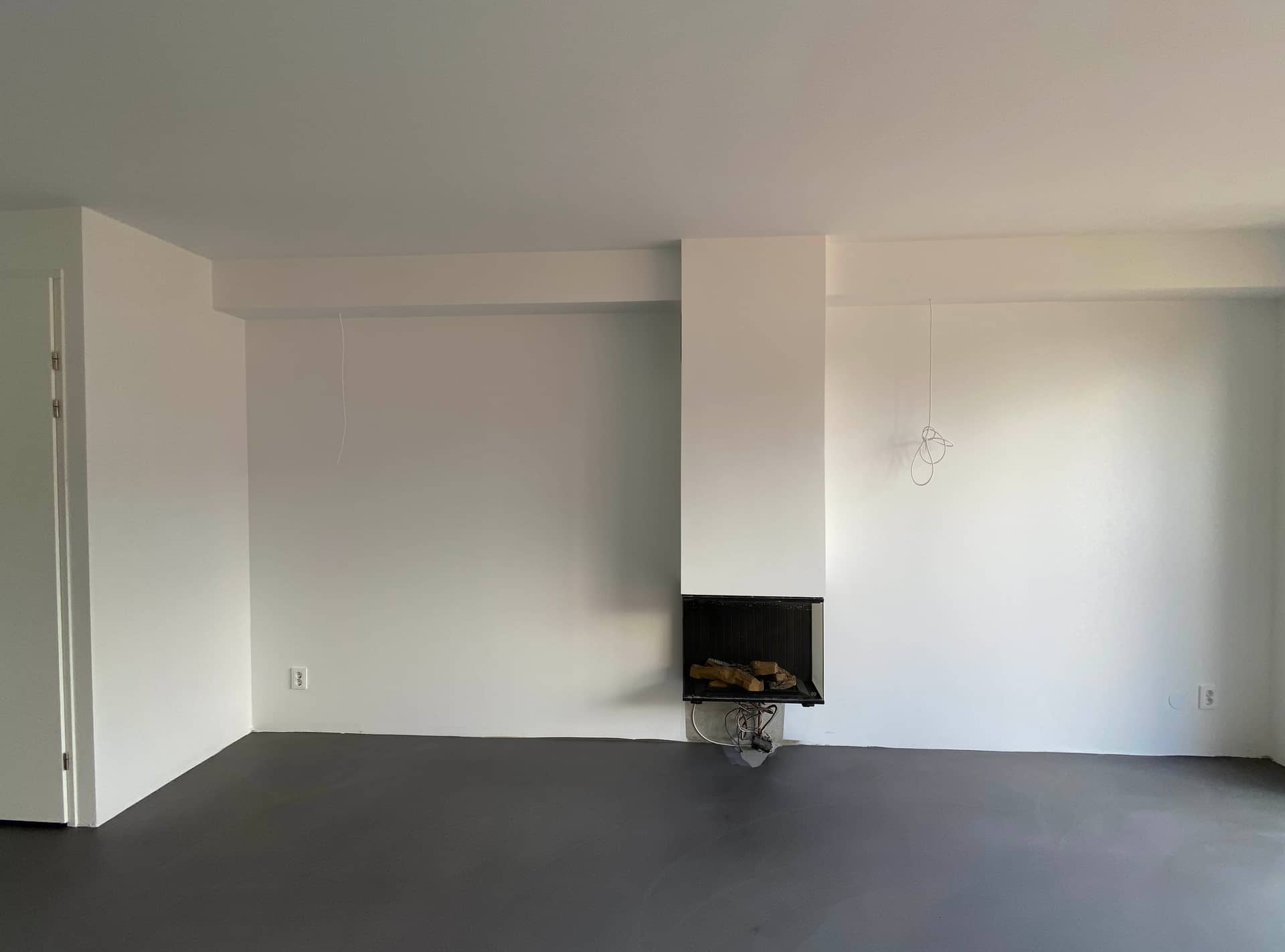 Renovlies nieuwbouw Amsterdam: voorbeeld opgeleverde woonkamer met haard